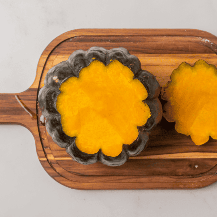 Ingredients needed for kabocha squash on cutting board.