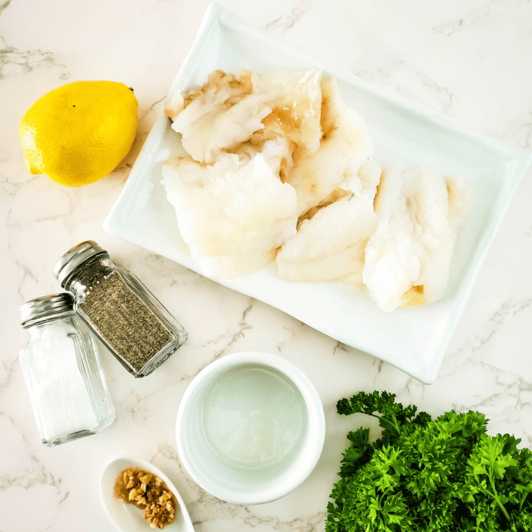 Ingredients Needed For Air Fryer Lemon Pepper Cod on kitchen table.