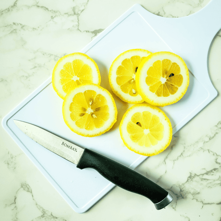 Patting cod fillets dry with a paper towel to remove excess moisture.
