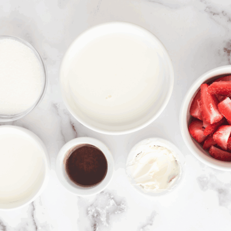 Ingredients needed for Ninja Creami Strawberry Ice Cream With Condensed Milk on kitchen table.