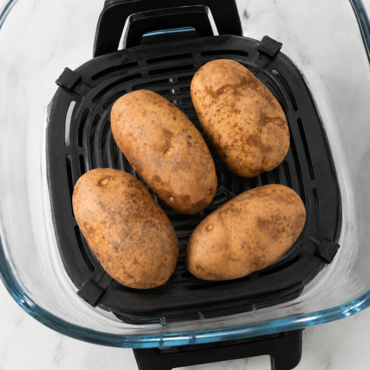 Ninja Crispi PowerPod attached and set to the Air Fry function to bake potatoes