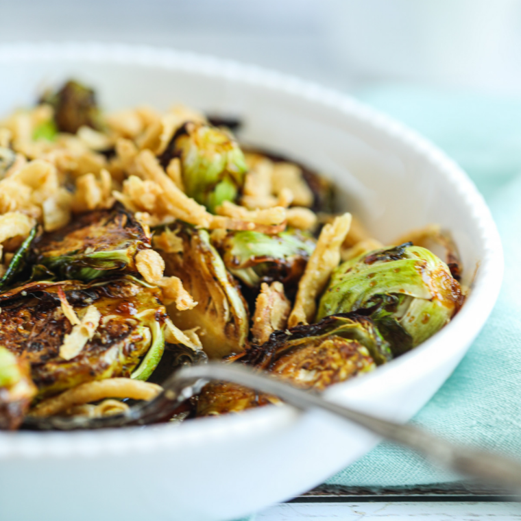 Ninja Crispi Brussels sprouts with crispy bacon on a plate