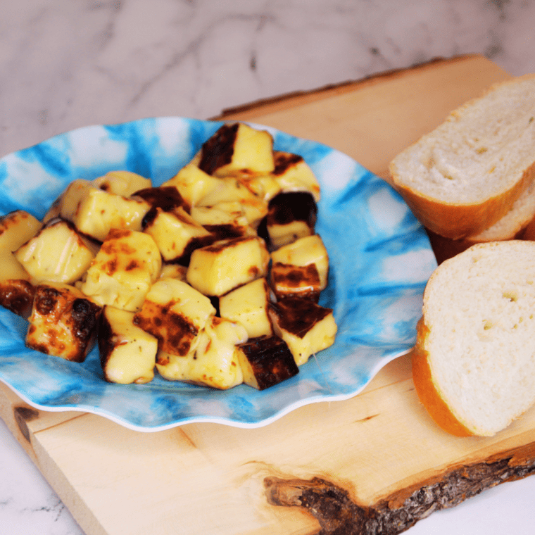Plate of Trader Joe’s Bread Cheese on kitchen table.