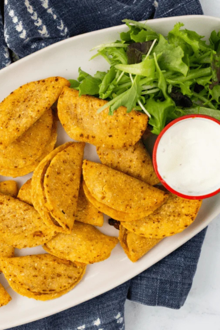 air fryer Trader Joe’s mini chicken tacos crispy golden shell served with dipping sauce