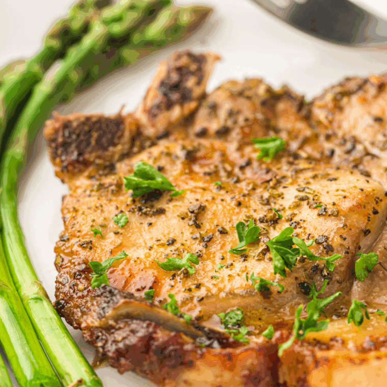Golden brown Waffle House-style pork chops served hot on a plate
