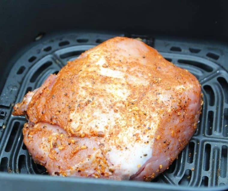 Pork roast air fryer in the basket.