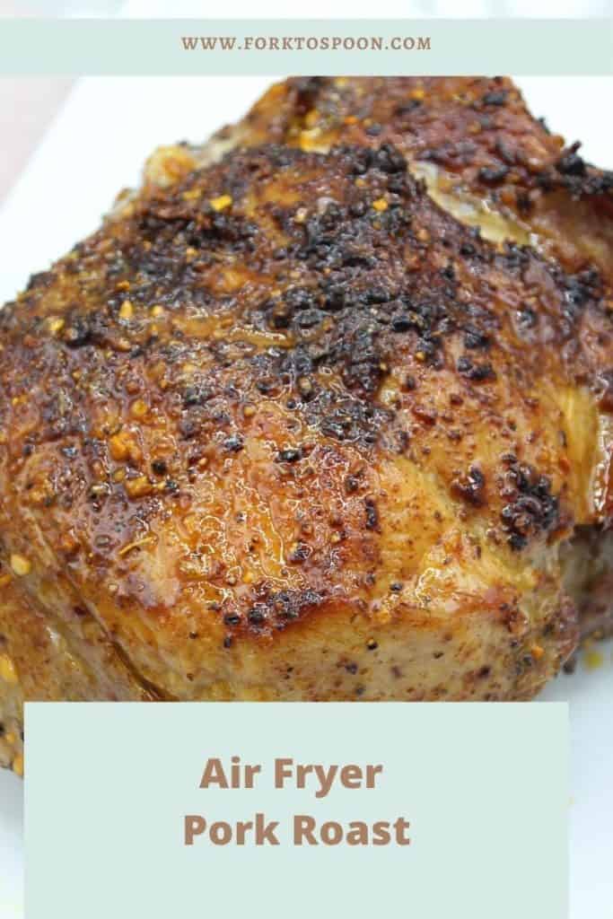 Close up of completed pork roast air fryer recipe with overlay text reading "Air Fryer Pork Roast"
