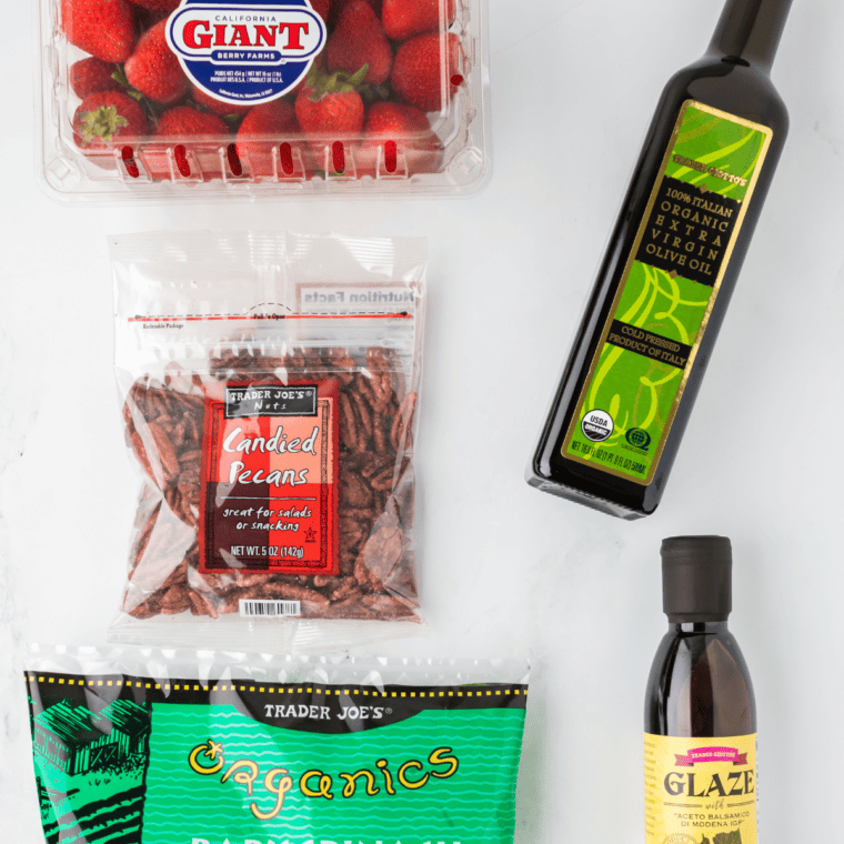 Ingredients needed for Air Fryer Spinach Strawberry Salad on kitchen table.