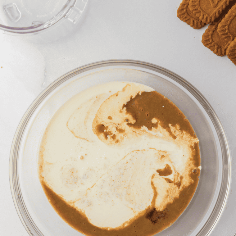 Stirring molasses and brown sugar into the spiced ice cream base