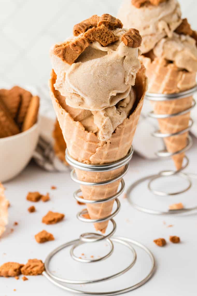Creamy homemade gingerbread ice cream served in a glass with a spoon
