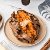 Outback Steakhouse sweet potato recipe served split open with honey butter melting into the flesh