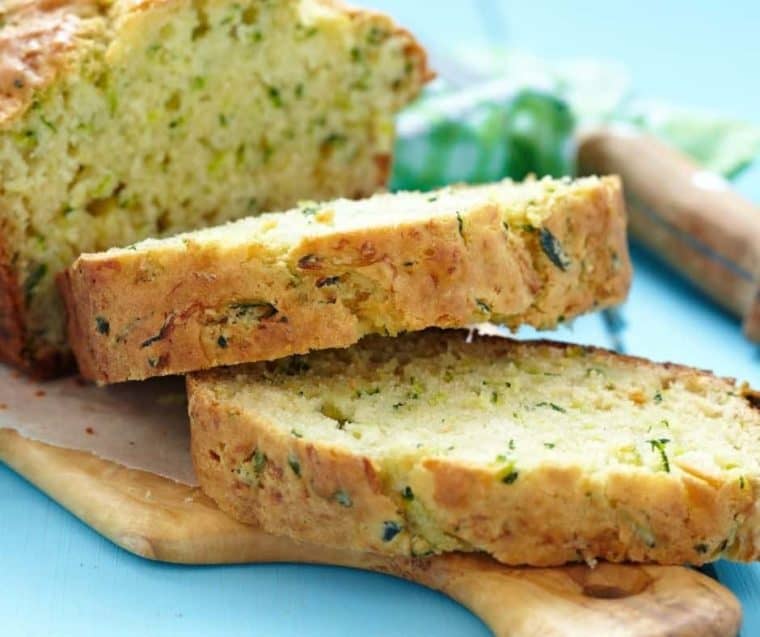 sliced loaf of zucchini bread on cutting board