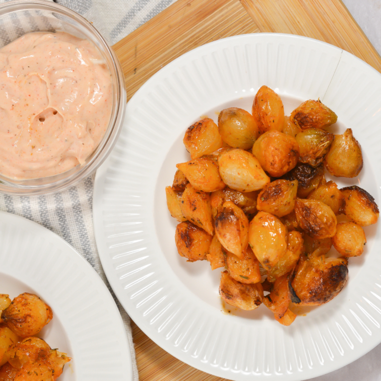 Cheesy air fryer blooming onion bites topped with grated Parmesan