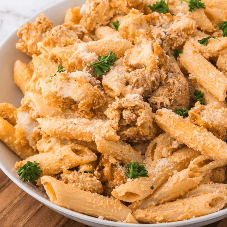 Air fryer buffalo chicken pasta with creamy sauce and pasta.