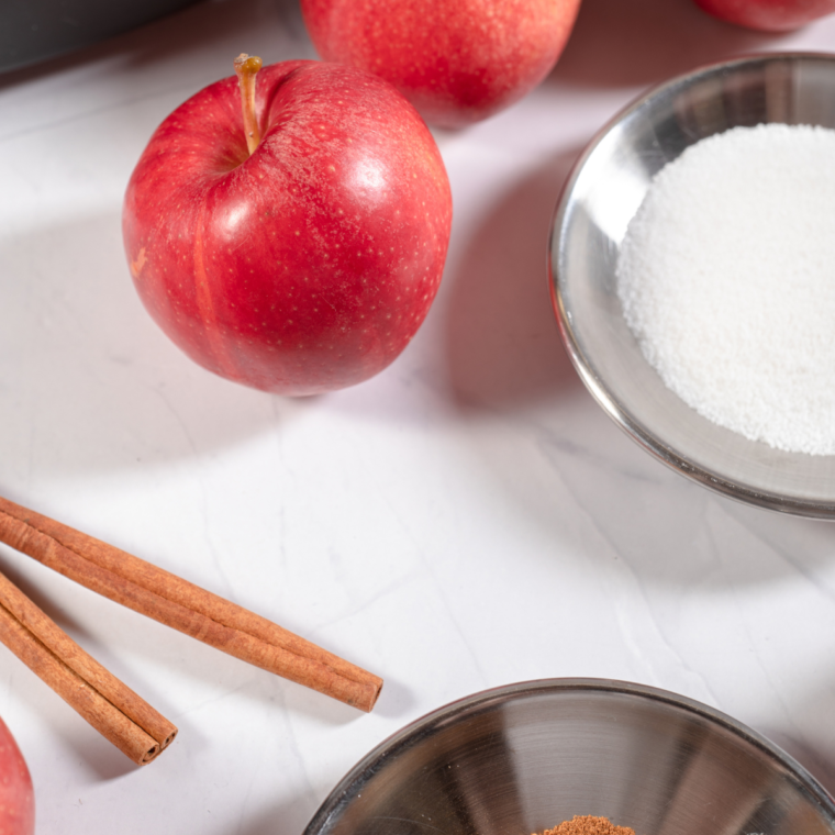 Ingredients for air fryer apple chips: fresh apples and ground cinnamon