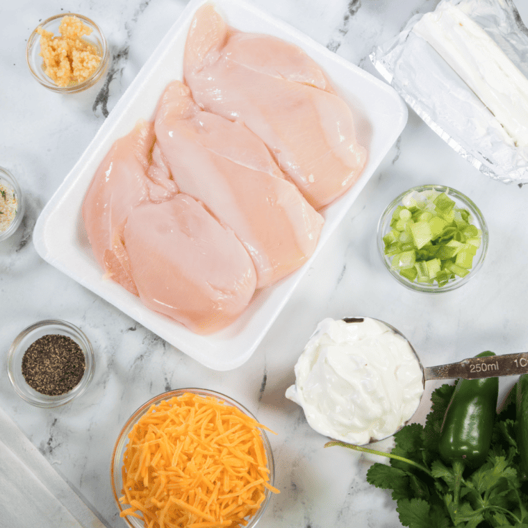 Ingredients needed for Air Fryer Jalapeño Popper Chicken Casserole on kitchen table.