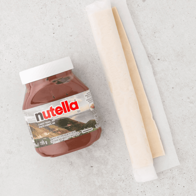 Indulge in the delightful combination of flaky pastry and creamy chocolate with these Air Fryer Nutella Scrolls. A perfect treat for any time of day, these scrolls are not only easy to make but are sure to satisfy any sweet tooth. Here are the ingredients you'll need to create this delicious dessert: