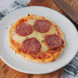 This air fryer pepperoni naan pizza cooks in 8 minutes flat using a 380°F pre-crisp trick that keeps the bottom shatter-crisp instead of soggy. With six pantry ingredients and one piece of naan bread, you get a personal pizza that beats delivery — every single time.