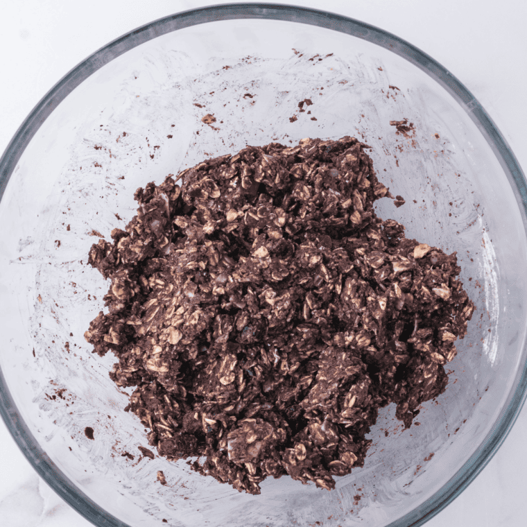 Shaping the chilled mixture into 12 uniform protein balls by hand.