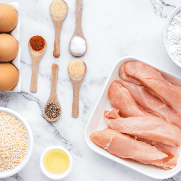Ingredients needed for Whataburger Chicken Strip Recipe on kitchen table.