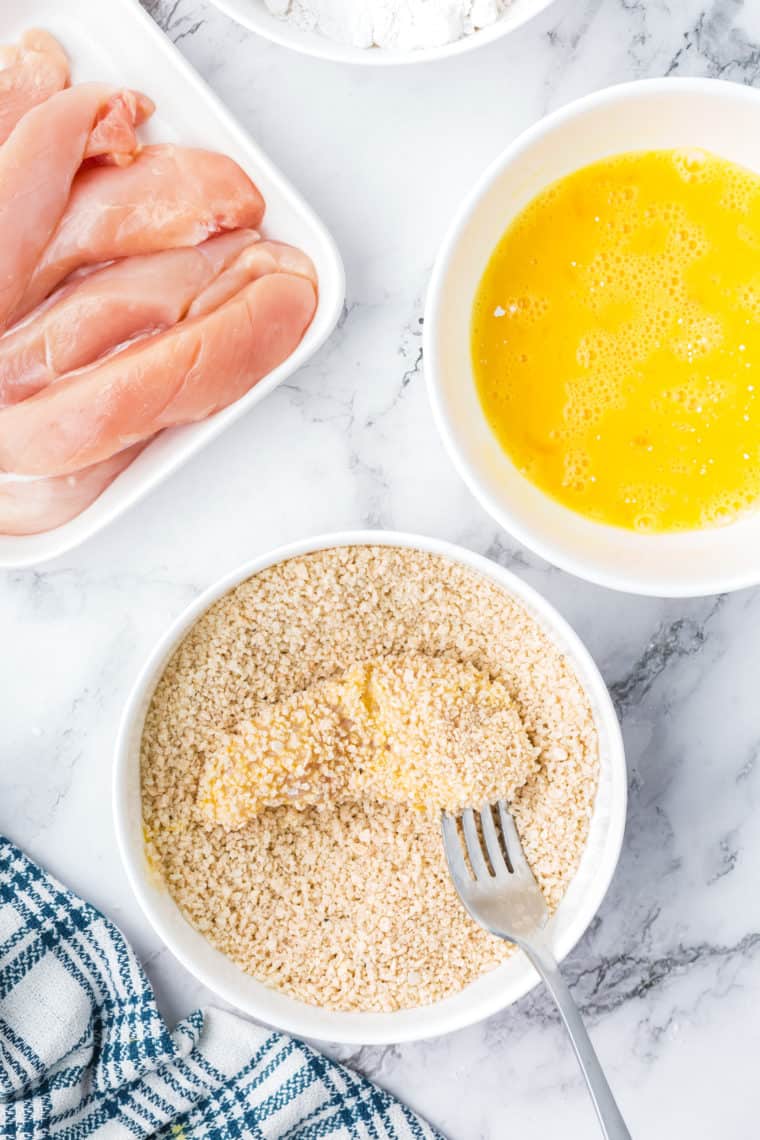 Coat the chicken strips in the batter.