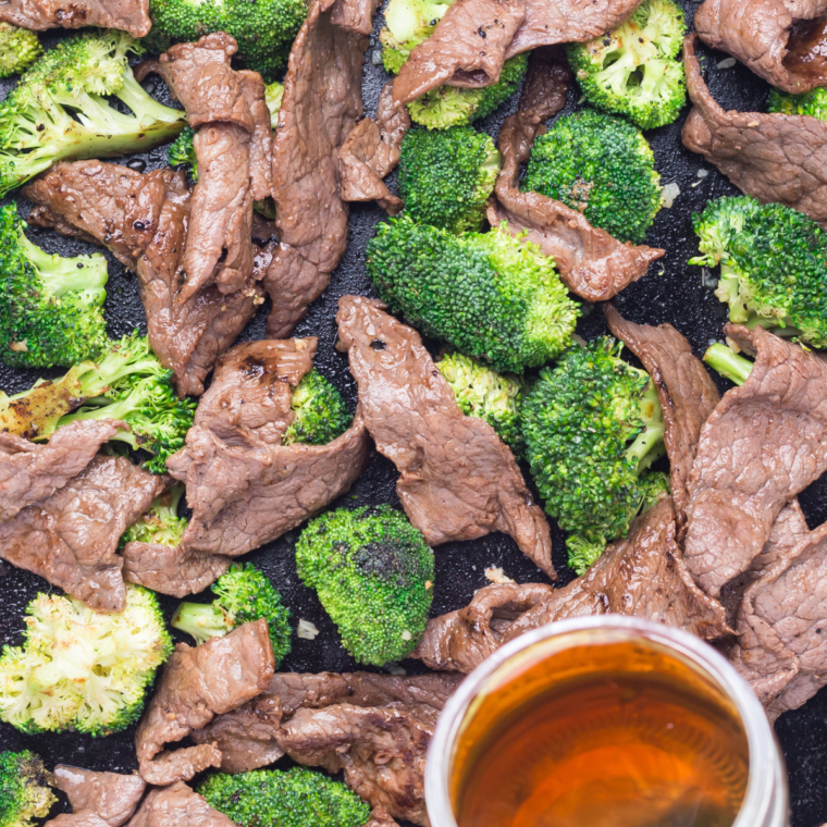Beef and broccoli tossed together on the griddle with glossy stir-fry sauce thickening into a rich coating.