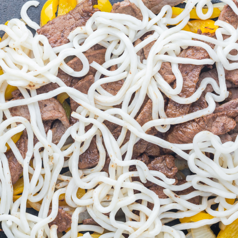 Finished Blackstone steak udon tossed together with steak, noodles, and vegetables