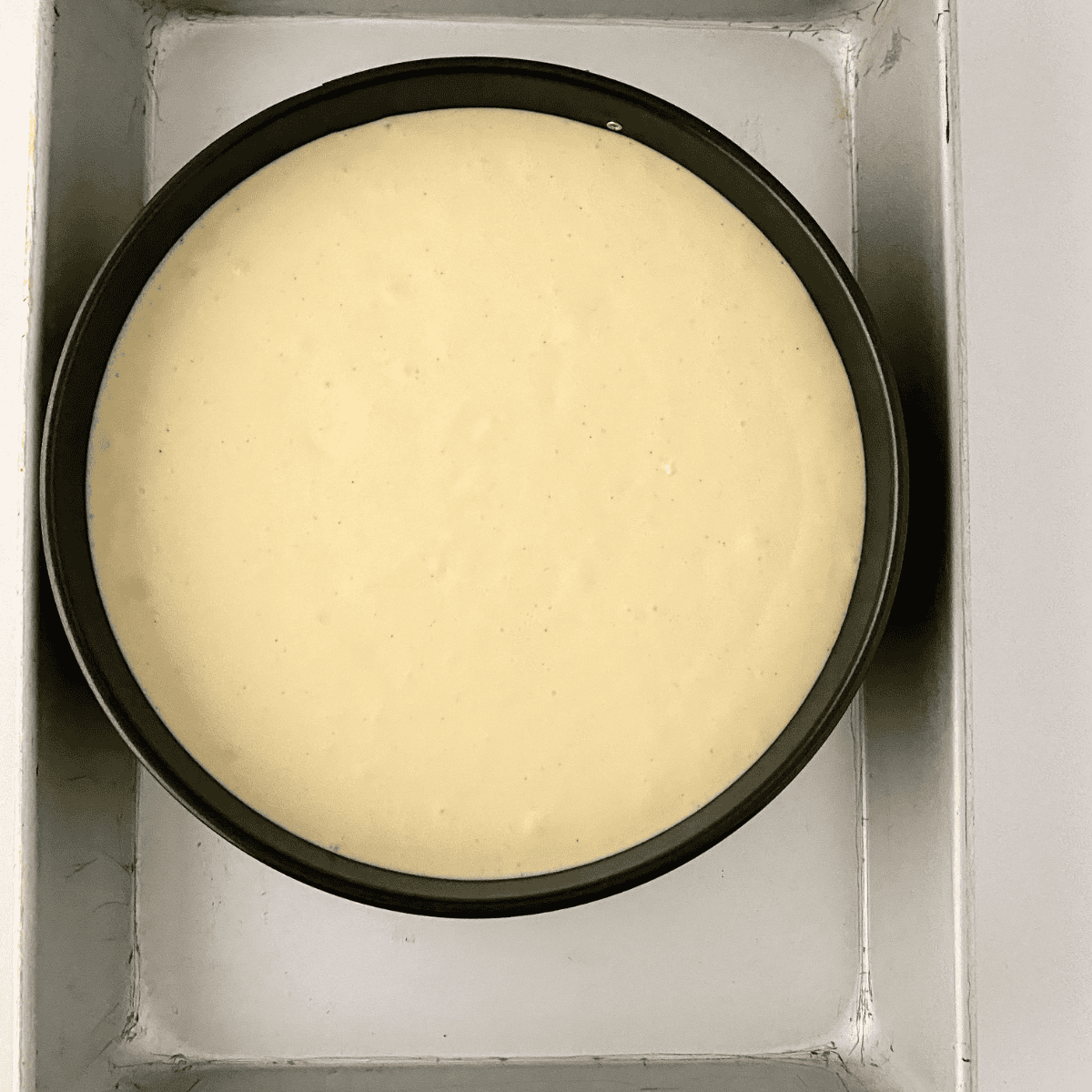 Place the cheesecake into the baking pan.