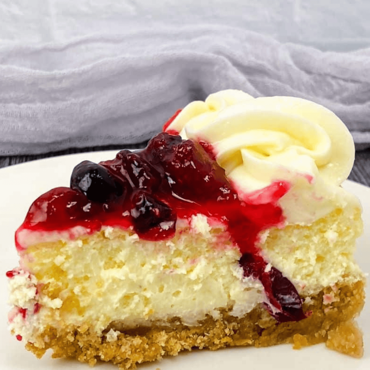 Creamy cranberry cheesecake inspired by the Cheesecake Factory, topped with a glossy cranberry layer.