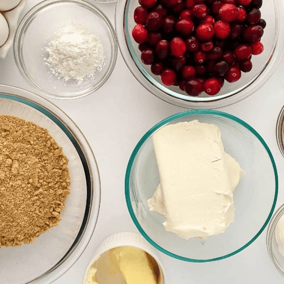 Ingredients needed for Cheesecake Factory Cranberry Cheesecake Recipe on kitchen table.