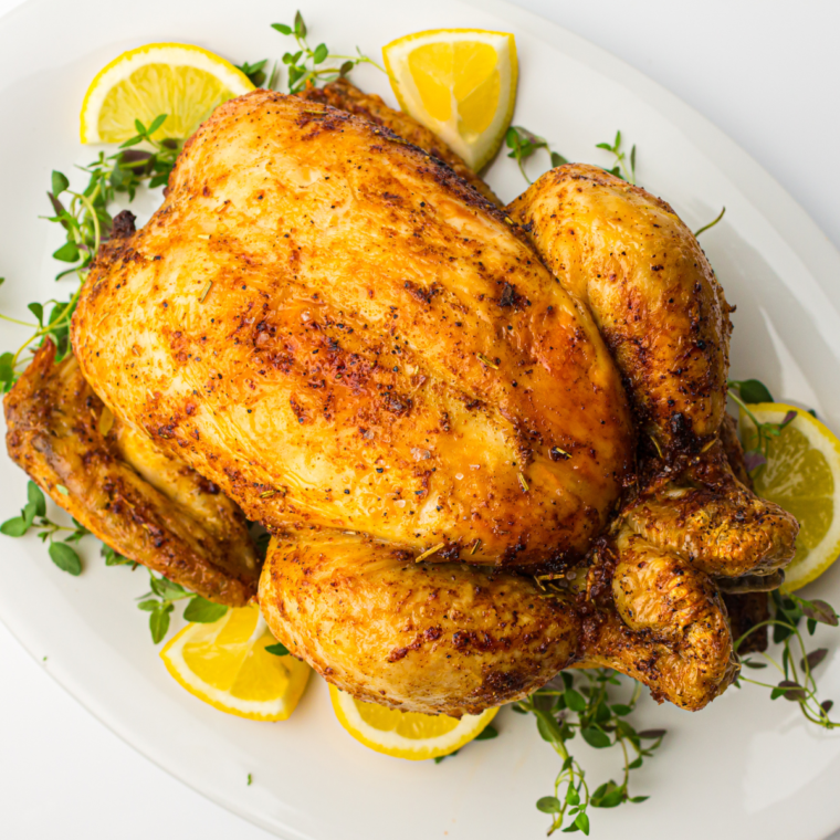 Golden, juicy Copycat Costco Rotisserie Chicken ready to serve with crispy skin and flavorful seasoning.