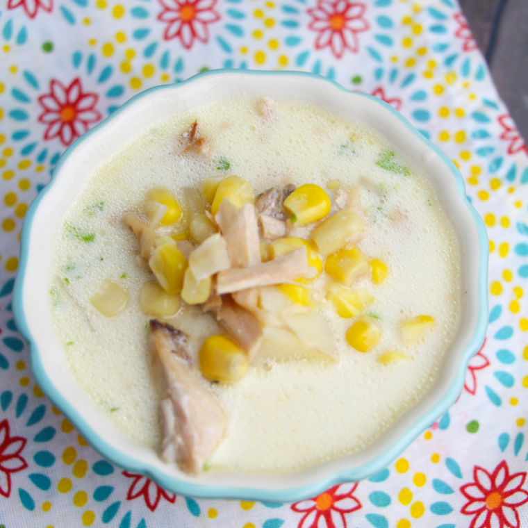 Bowl of creamy slow cooker turkey white bean chili with cilantro and lime