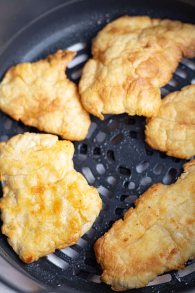  Air Fryer Homemade Authentic Turkish Balloon Bread puffing up in the air fryer, crispy on the outside and soft inside.