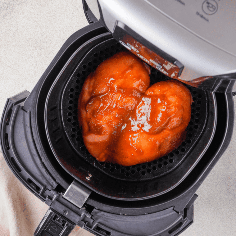 Seasoning chicken pieces before air frying for salad