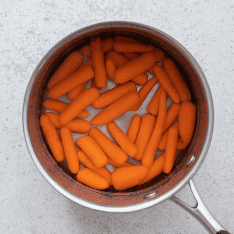 Simmering the carrots in the sauce on the stove for Cracker Barrel Carrots recipe."