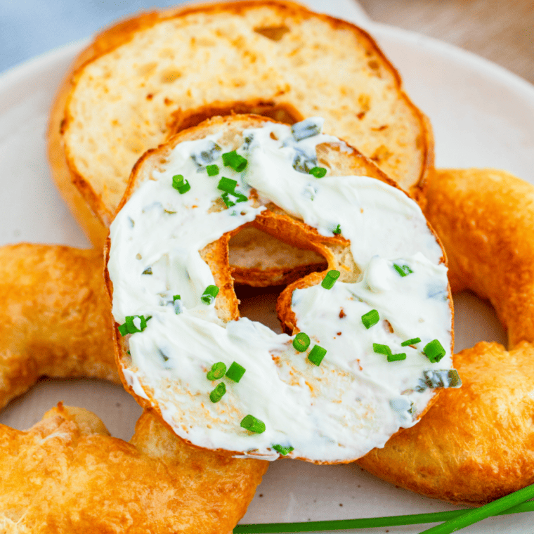 "Close-up of golden brown 2-Ingredient Air Fryer Bagels with a crispy exterior"