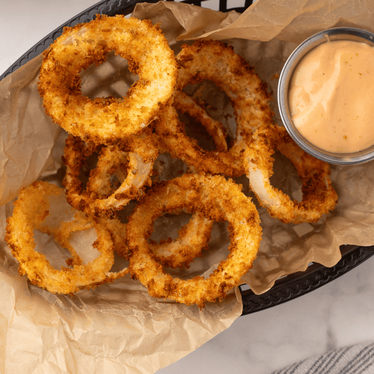 Plate of golden, crispy Air Fryer Beer Battered Onion Rings.