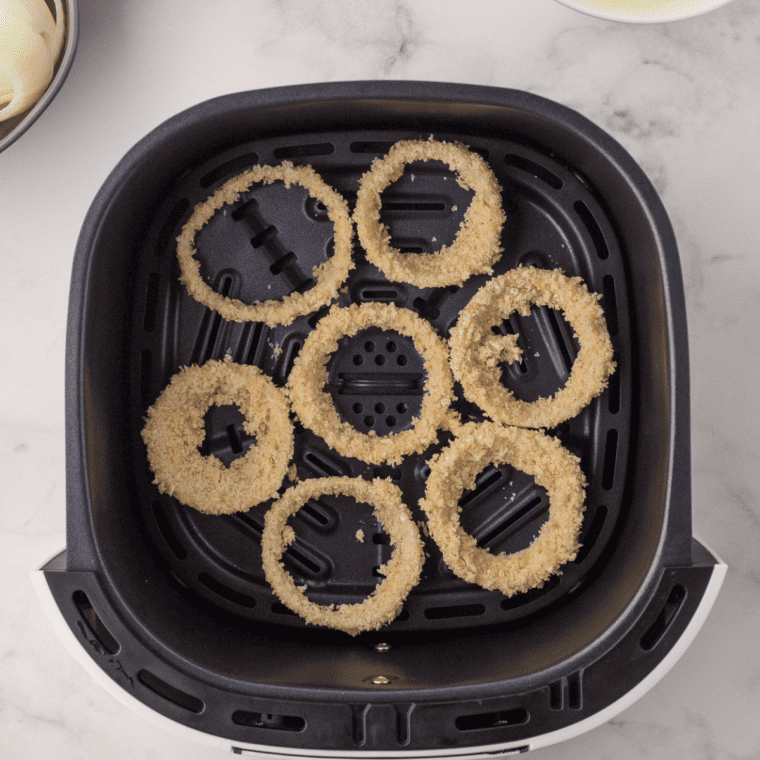 Air frying onion rings for 10-12 minutes, flipping halfway through, until golden brown and crispy.