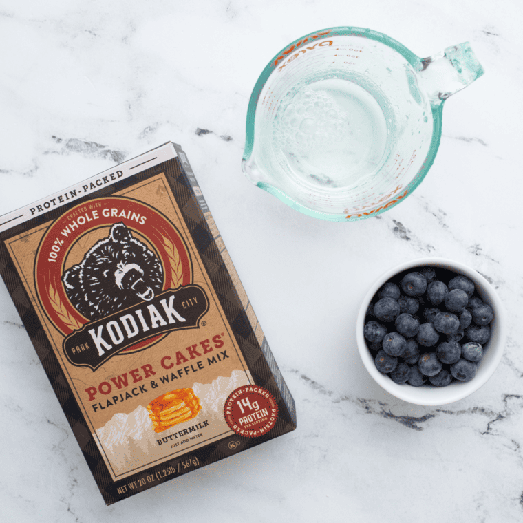 Ingredients needed for Air Fryer Blueberry Pancakes (Fluffy, Foolproof, Ready in 12 Minutes) on kitchen table.