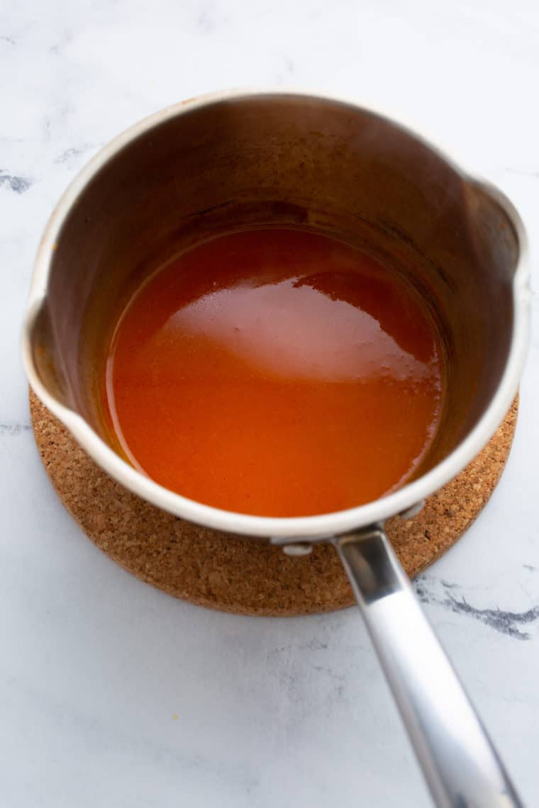 Combine Ingredients: In a medium-sized saucepan, whisk together the ketchup, Fireball Cinnamon Whisky, brown sugar, apple cider vinegar, Worcestershire sauce, mustard, garlic powder, and onion powder.
Simmer and Stir: Place the saucepan over medium heat and bring the mixture to a simmer while stirring constantly. This helps dissolve the brown sugar and ensures all the flavors meld together.
Reduce Heat: Once the sauce begins to simmer, reduce the heat to low to maintain a gentle simmer.
Simmer and Stir: Continue to simmer the sauce for about 15-20 minutes, stirring occasionally. This allows the sauce to thicken and intensify in flavor.
Taste and Adjust: Taste the sauce and adjust the seasonings if necessary. If you prefer a spicier sauce, you can add a dash more Fireball Whisky or a pinch of cayenne pepper.
Cool and Store: Remove the saucepan from the heat and let the Fireball BBQ Sauce cool to room temperature. Once cooled, transfer it to an airtight container or glass jar.
Store: Store the sauce in the refrigerator for up to a few weeks. The flavors will continue to meld and improve over time, making it even more delicious.
Now you have a batch of homemade Fireball BBQ Sauce ready to add a fiery kick to your grilled meats, burgers, ribs, or any dish that craves a sweet and spicy barbecue touch. Enjoy the bold and exciting flavors of this unique condiment!