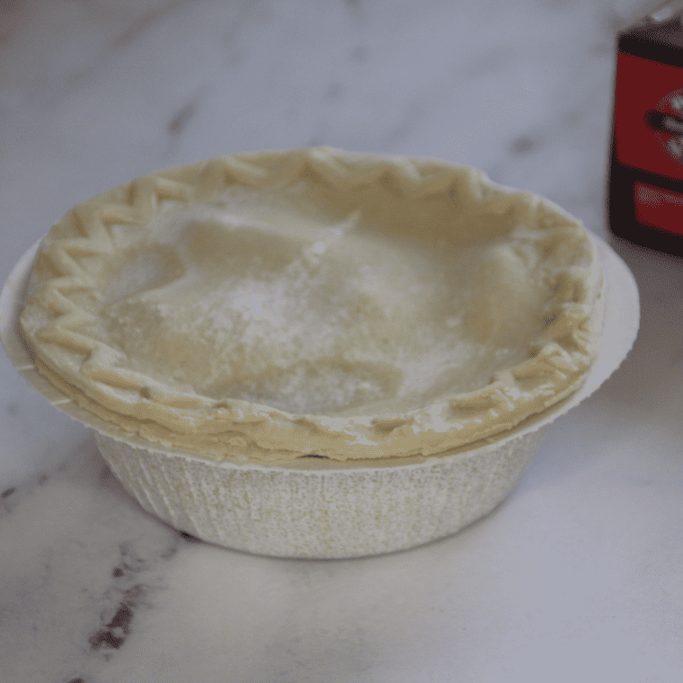 Preheat the Air Fryer: Begin by preheating your air fryer to 360°F (182°C). This ensures that the pot pie starts cooking immediately and evenly. Prepare the Air Fryer Basket: If you choose to use cooking spray, lightly coat the air fryer basket to prevent the pot pie from sticking. This step is optional, depending on your air fryer model. Place the Pot Pie in the Air Fryer: Remove the Boston Market Chicken Pot Pie from its packaging. Place it in the air fryer basket. If the pie comes in a foil dish, make sure it is air fryer safe before using it. Cover with Foil: To prevent the top crust from burning or cooking too quickly, you can loosely cover the pot pie with a piece of aluminum foil. Make sure the foil doesn’t touch the heating element of the air fryer. Cooking Time: Cook the pot pie for about 25 to 30 minutes. Halfway through the cooking time, you can remove the foil to allow the crust to become golden brown. Check for Doneness: The pot pie is done when the crust is golden brown, and the filling is hot and bubbly. You can insert a knife or a skewer into the center of the pie to check if the inside is hot. Let it Cool: Once done, carefully remove the pot pie from the air fryer and let it cool for a few minutes. This allows the filling to set and makes it easier to slice. Serve: Your Boston Market Chicken Pot Pie is now ready to enjoy. Serve it warm for the best flavor.