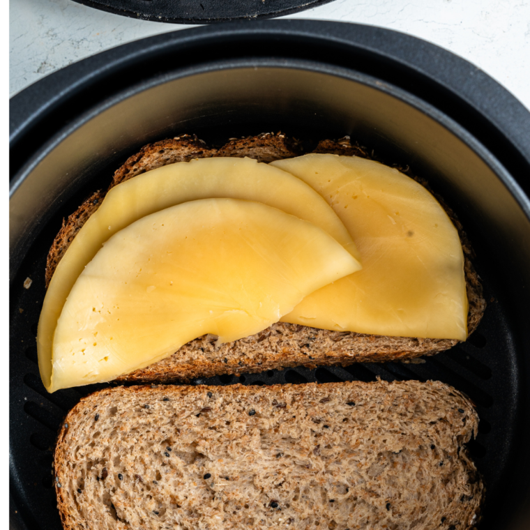 Air fryer grilled cheese cooking at 350°F until cheese melts perfectly