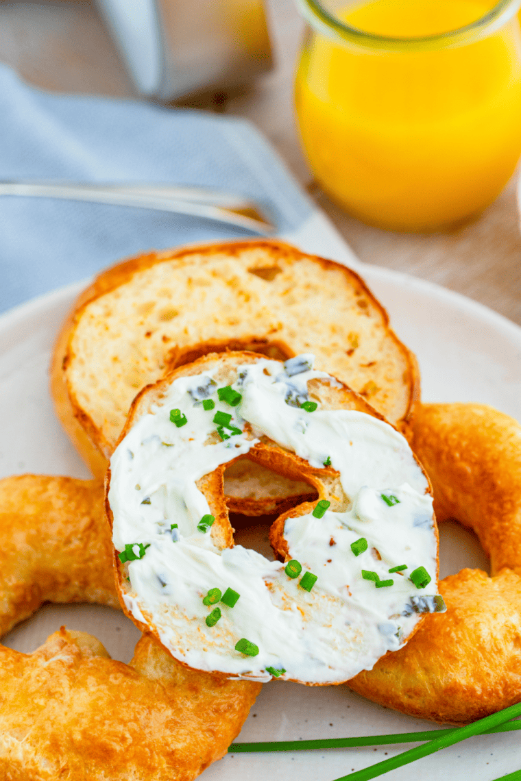 Close-up of freshly baked Air Fryer 2-Ingredient Bagels with a golden crust and topped with sesame seeds