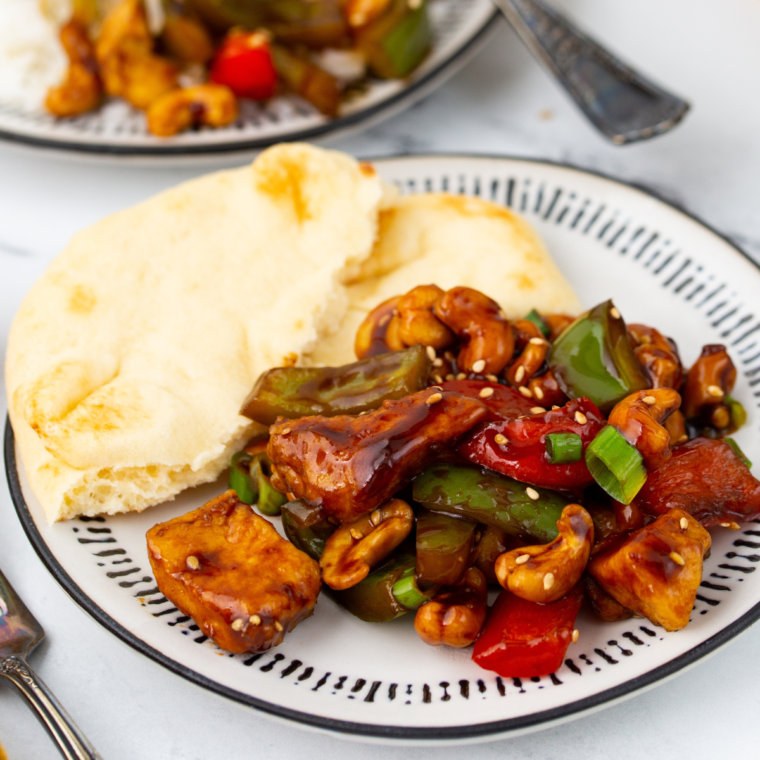 "Delicious Air Fryer Cashew Chicken plated with tender chicken and flavorful sauce."