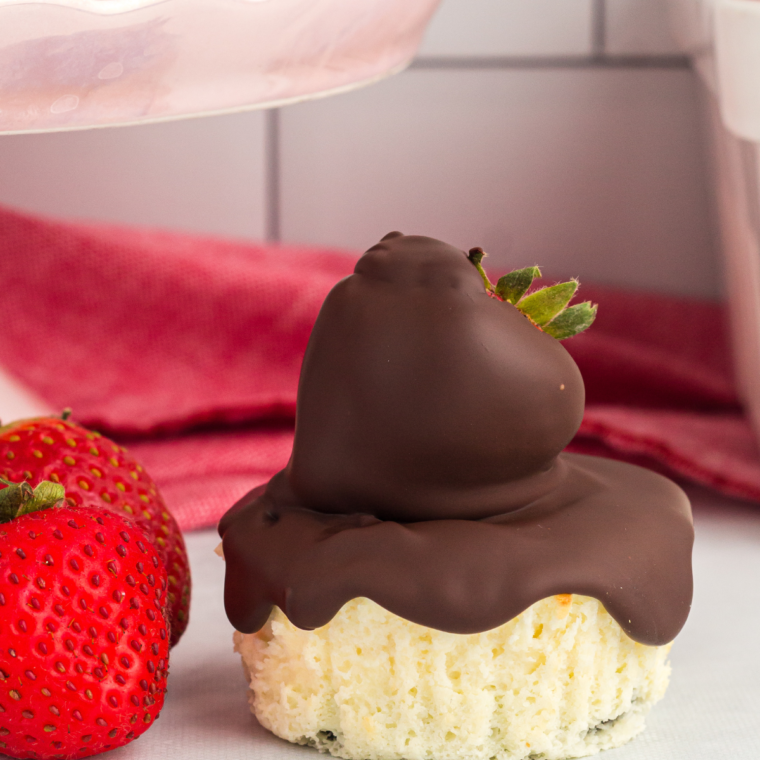A mini chocolate cheesecake cut open to show the creamy filling and Oreo base