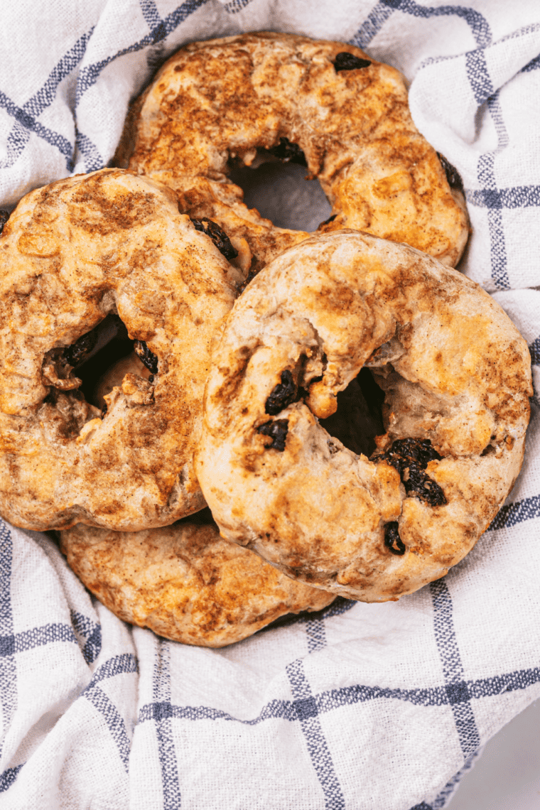 "Cinnamon raisin bagels made in the air fryer, topped with a sprinkle of cinnamon"