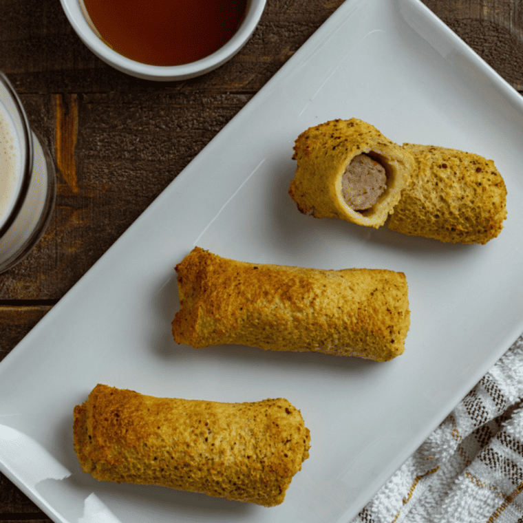 Plated French toast sausage roll-ups ready to serve