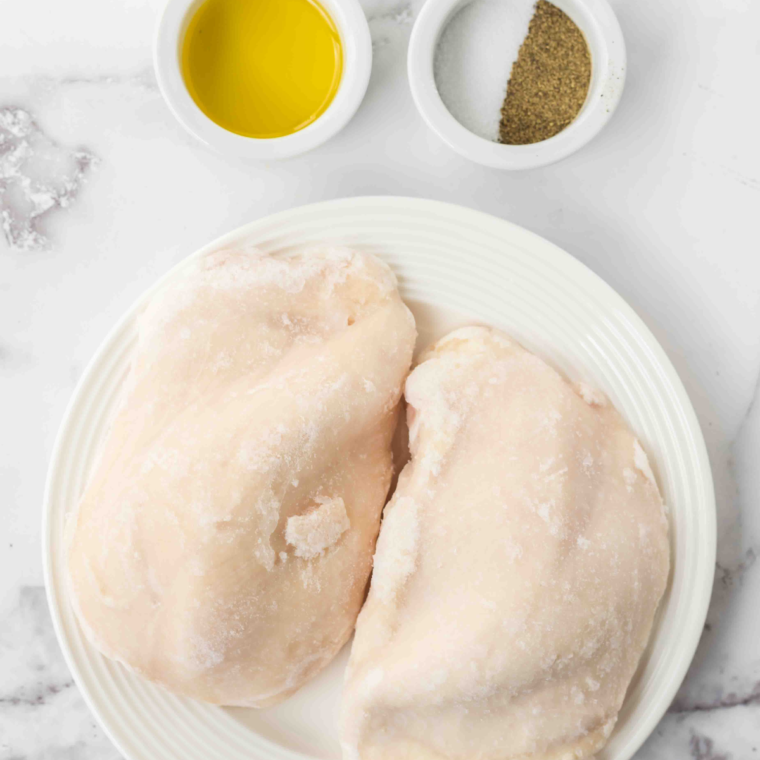 Ingredients Needed For Air Fryer Frozen Chicken Breast on table.
