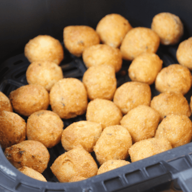 Crispy golden brown air fryer frozen hush puppies fresh out of the basket