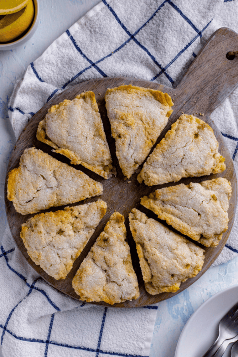 Air Fryer Lemon Scones – golden, fluffy scones with sparkling sugar on top, served on a plate.